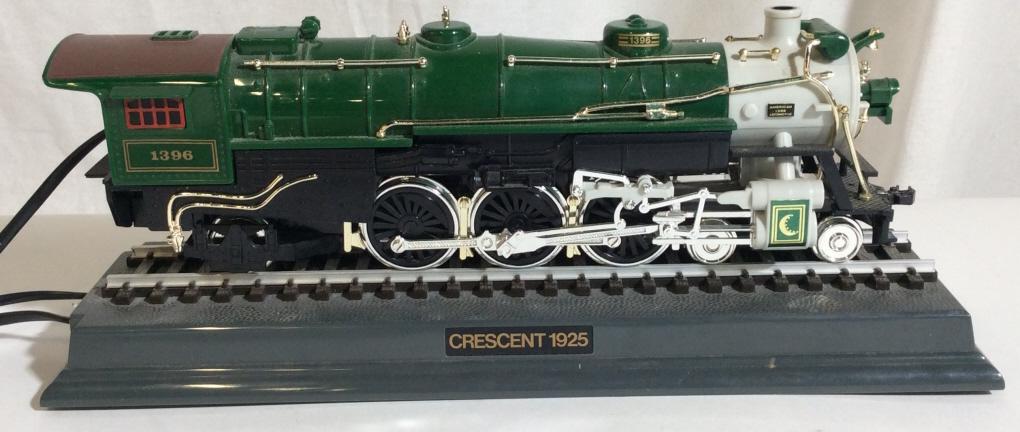Vintage TELEMANIA Train Telephone: Vintage, novelty, train telephone. Phone base is labeled Crescent 1925, the name of the train exponent is modeled after. The piece measures approx 4.6 inches H, 11.6 inches W, and 3.75 inches deep. Vi