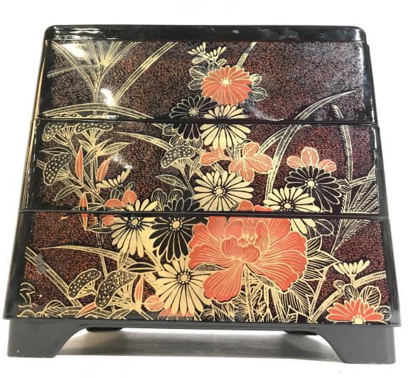 3 Level Asian Bento Box: Bento Box has 3 levels. Contains tones of red, black & gold. Piece contains intricate floral and leaf detail. Piece measures approx 7 inches tall 8 inches wide. asian tableware, asian arts and crafts,