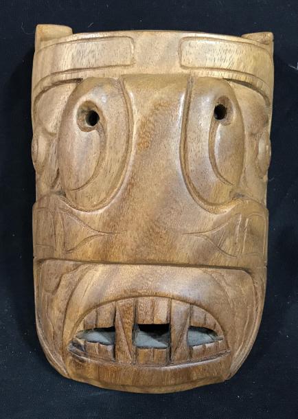 Signed Inuit Eskimo Carved Wood Mask: Signed Inuit Eskimo Mask Carved Wooden with openwork design, signed illegibly on underside in silver toned pen, includes leather strap for easy wall display, measures approximately 8 inches tall x 5.7