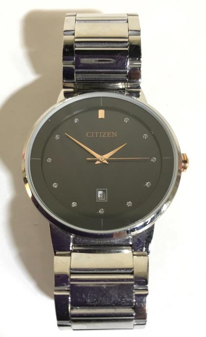 Silver Toned CITIZEN Wristwatch: Piece is trademarked CITIZEN. WRISTWATCH is silver toned with black toned face. Clock face measures approximately 1.65 inches wide. Wristwatch, Citizen wristwatch. fashion accessories and jewelry mens