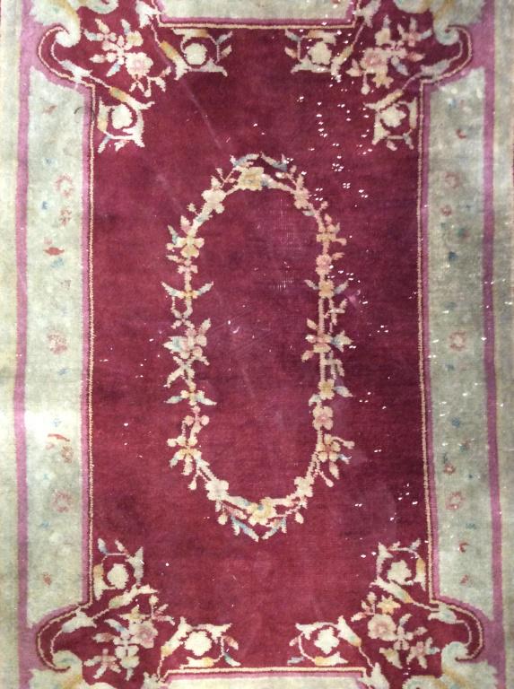 Vintage Handmade Chinese Art Deco Rug: Rug is vintage and handmade possibly antique. Piece contains multi toned floral & leaf detail. Handmade rug, vintage rug, Chinese Art Deco rug. Piece evident wear, and fraying to edges. Needs cleaning