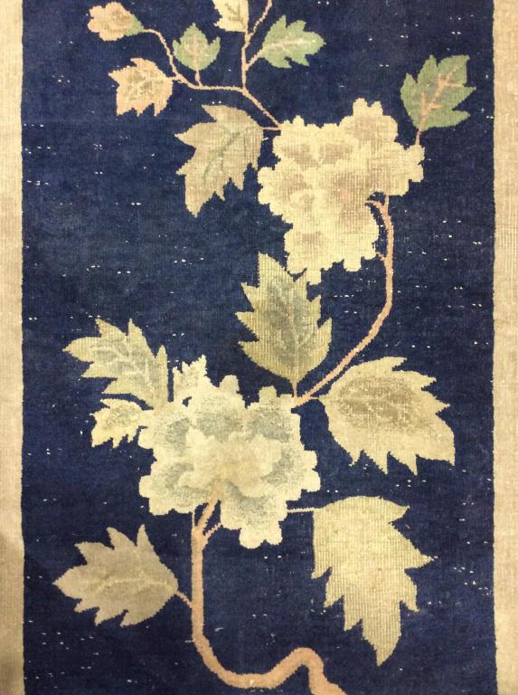 Antique Handmade Chinese Art Deco Wool Rug: Rug is wool and handmade. Piece is antique. Rug has toned of blue, sand, Slate & green. Contains floral & leaf detail. Piece measures approx 58inches long 30 inches wide. Contains evident wear & frayi