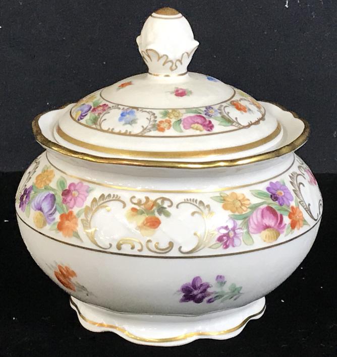 Schumann German Porcelain Sugar Bowl: Vintage Bavarian Porcelain Sugar Bowl And Top. Thick Gilt Rims. Style- Empress Dresden Flowers. Underside marked with Schumman Lion Crest. Hallmarked on underside. No chipping, cracks, paint fade. App