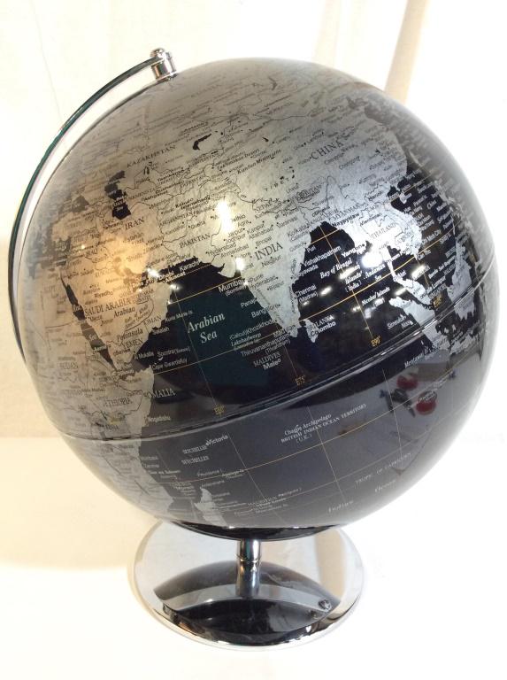 Black Toned World Globe On Chrome Base: Globe is black, silver & gold toned. Piece has chrome base. Piece measures approx 14.5 inches tall 12 inches wide. Globe, black globe, teacher supplies, world globe. 6