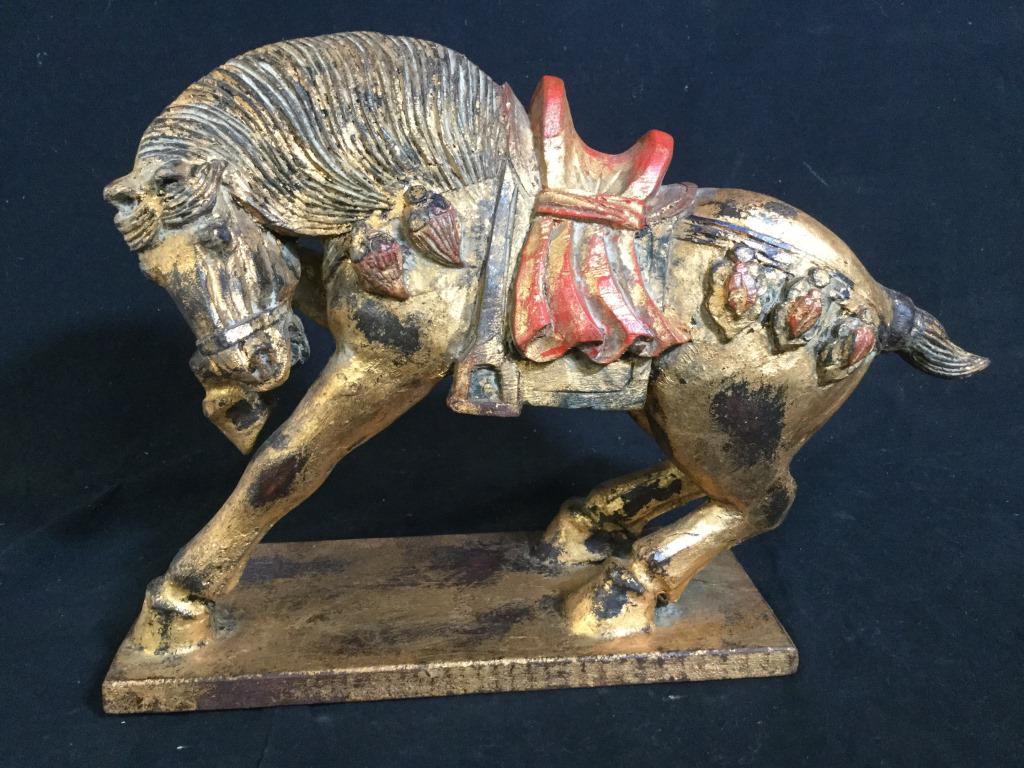 Vintage Gilded Wooden Horse Sculpture: Vintage, possibly antique, horse sculpture. The piece is colored in red and gold tones. The piece measures approx 10.75 inches H, 11.25 inches Long, and 5 inches W. There is some wear present due to t
