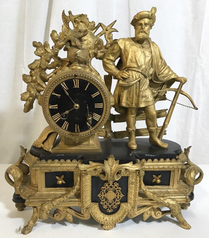 Antique Gilded Metal Radial Clock w Figural: Ormolu mounts, Gilded Clock, Vintage Possibly antique, decorated with an Elegant European gentleman. Key is included. Piece is gilded and crafted from wood and metals. The piece measures approx 13.6 i