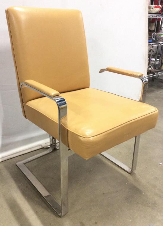 Vladimir Kagan MCM Chrome and Leather Chair: Tag on underside reads VLADIMIR KAGAN DESIGNS. Circa 1970’s. Measures approx 36 inches tall 22 inches wide 24 inches deep. Piece has chrome arms & Base. Leather has light beige tone. Contains some m