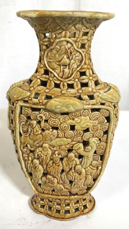 Glazed Ceramic Chinese Buddhist Relief Vessel: Possibly vintage Glazed Ceramic Vessel, features a relief depicting monk like figures among clouds and dragons. The vessel is sculpted in an intricate grid like pattern, and winged creatures flank eac