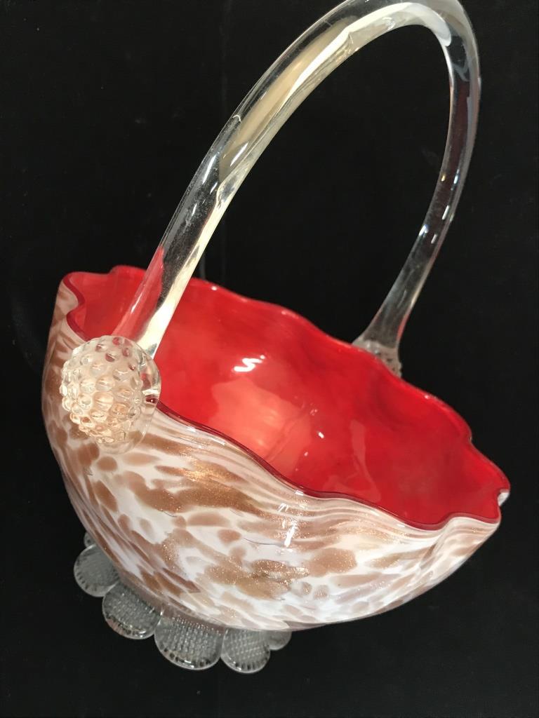 Multi Color Murano Glass Basket Form Bowl: Vintage Murano Basket Bowl. Interior Red Colored Glass. Exterior White with spattered large gold flecks. Furl Rim, Decorative side ornamental decor in relief at base on basket handle. Hand blown ponti
