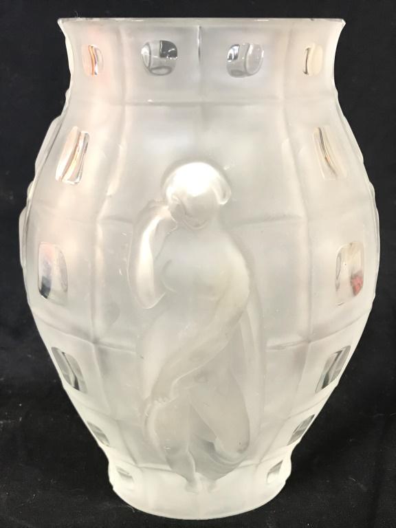 DESNA Female Nude Cut Crystal Vase: Underside of piece is signed DESNA. Vase has female nude figures on each side. Vase is cut crystal. Piece has frosted detail. Piece measures approx 9.5 inches tall 6.5 inches wide. Czech vase, crystal