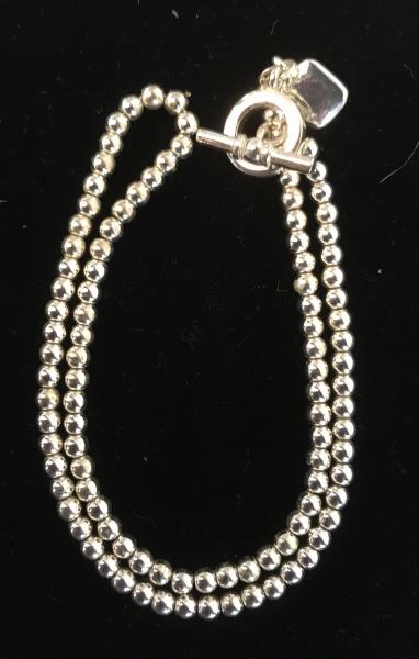 Beaded Ball Ralph Lauren Choker w/ Toggle Clasp: silver tone polished metal beads. Length 15 in. Charm with Lauren Ralph Lauren Logo. Toggle Clasp. Designer Necklace, Ralph Lauren, Lauren, Ball Bead, Silver Tone, Fashion Choker Necklace, Wearable Fa