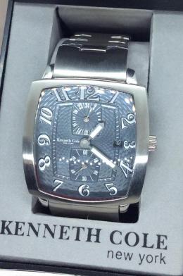 Kenneth Cole NY Men's Wrist Watch, New Boxed: In original Box. Instruction Booklet included. brushed stainless steel. Iridescent Blue Watch face with face hands. Rounded glass. Interior military hour time dial and seconds dial. Water resistant, b