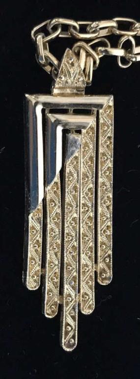 MONET Art Deco Gold Tone Pendant Necklace: Geometric style pendant, 2 in. Pendant appears to have slight green discoloration in center. Long chain, app 24 in.. Fashion Necklace, art decor pendant, wearable fashion, everyday fashion, chain neck