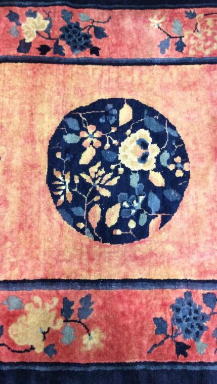Vintage Handmade Chinese Art Deco Wool Rug: Rug is wool and handmade. Rug is vintage possibly antique. Rug contains fringes. Piece contains tones of pink, navy, Slate, blue & cream. Piece has Medallion detail in center. Rug measures approx 84 i