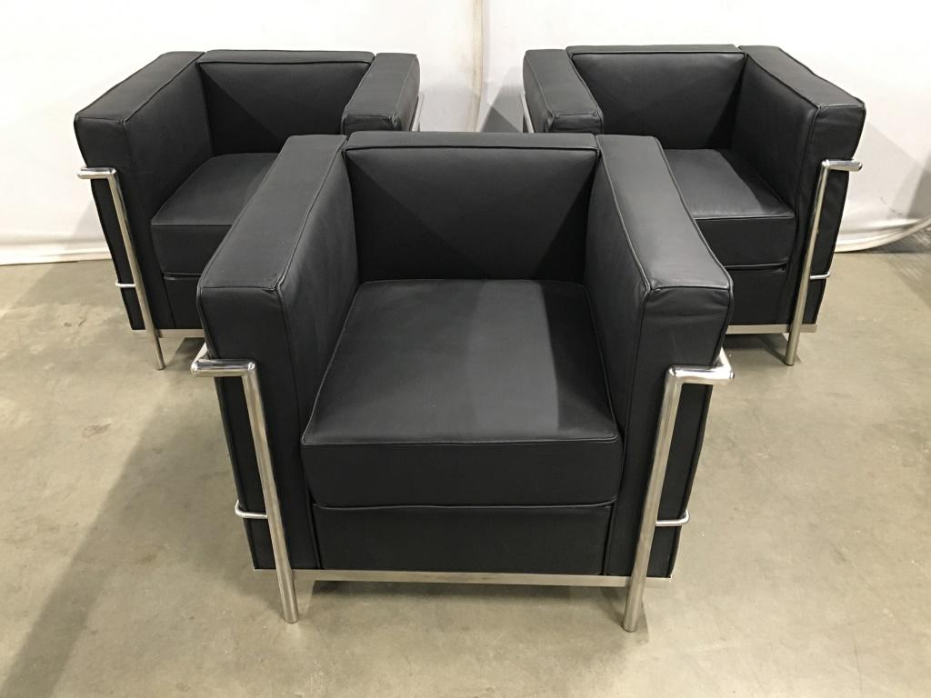 Set 3 Black Le Corbusier Style Armchairs: Set 3 Black Le Corbusier Style Armchairs with tubular chrome toned metal frame and black upholstered cushions, possibly leather, measures approximately 29 inches wide x 27 inches deep x 26 inches tall