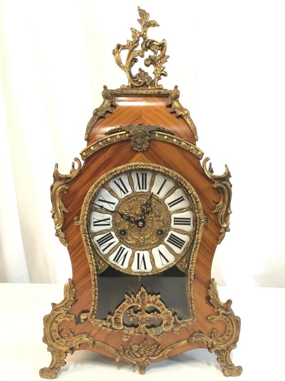 Vintage French Rococo Ornate Mantel Clock: Interior movement Reads FHS Germany appears to indicate movement is Frans Hermle & Sons, Numbered 151-070. Mantel clock has Rococo style. Contains ornate gold toned guilted metal detail. Piece has 4 g