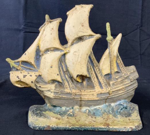 Eastern Specialty MFG Mayflower Cast Iron Doorstop: Vintage Mayflower Cast Iron Doorstop Marked Mayflower 59 Eastern Specialty MFG Co on reverse, some wear to painted finish due to age and use, measures approximately 9 inches wide x 8 inches tall x 2.5