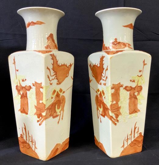 Pair Vintage Chinese Hand Painted Porcelain Vases: Pair Vintage Chinese Hand Painted Porcelain Ceramic Vases with raised design depicting Asian figures holding flags, jousting on horses and mountains in the background in paprika and yellow toned paint
