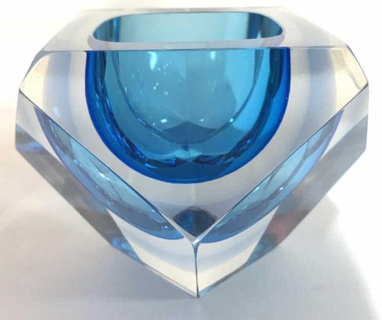 Art Glass Murano Candle Holder: Piece has an aqua tone. Art glass, tabletop accessories, decorative arts, hand formed, table wear. Piece is possibly Murano Glass. Measures approx 4 inches wide 3 inches tall. Piece has some minor imp