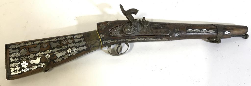 Middle Eastern Mother Of Pearl Detailed Firearm: Possibly a replica, Piece is wooden & has intricate mother of pearl detail. Middle eastern firearm, vintage firearm, Piece measures approx 20 inhces long 5 inhces tall. Piece is vintage possibly antiq