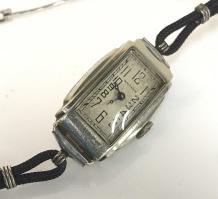 Waltham Retro Ladies Wristwatch: rectangular watch face in silver tone metal. Partial double cord and partial clasp that opens to fit over hand. Circumference 7.5 in. Not tested. Wristwatch, c. 1960s Wristwatch, Waltham, Ladies Acces