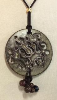 Lot3 Decorative ornaments and Fashion Accessories: Artisanal Pendant Necklace On brown rope. Pendant 2.5 in. diameter with hanging beads. Rope , 23.5 in. long. Art Deco Goddess Profile with sun rays. Can be made into a pin, ornament, or pendant. Casca