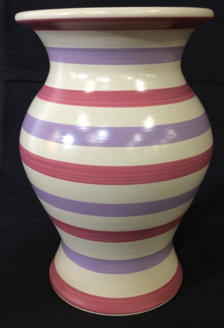 Hand Painted Decorative Earthenware Vase, Peru: This piece is a decorative vase, appears to have been crafted from clay. The piece measures approx 8.75 inches H, and 6 inches in diameter. The piece has been colored in pastel tones of lavender, Rose