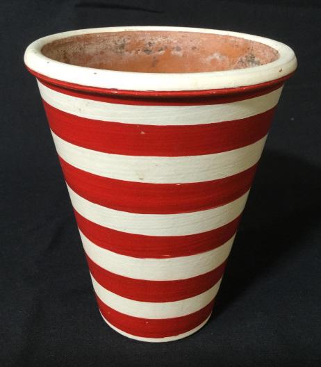 Signed Decorative Earthenware Planter: Decorative Hand Painted flower pot, stoneware pottery, The piece is painted in a striated pattern, with red and white alternating stripes. The piece is signed on its underside, illegibly. The piece me