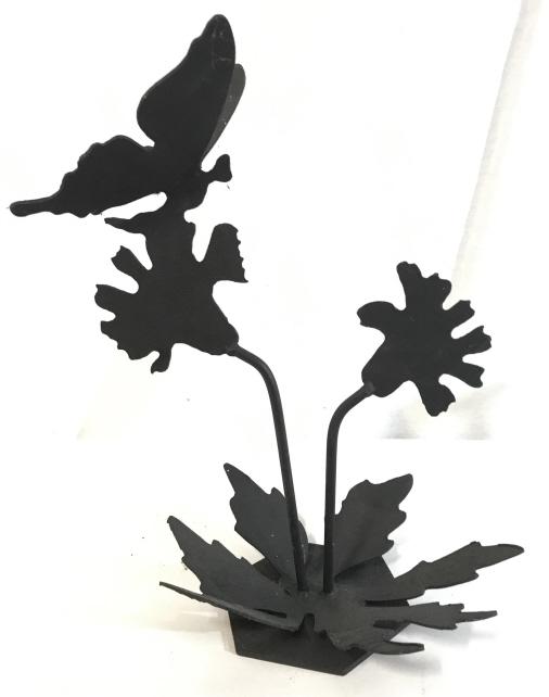 Vintage Cast Iron Butterfly Sculpture: This is a cast iron butterfly sculpture, the piece depicts a butterfly feeding on flowers. The piece is vintage, possibly antique. The piece measures approx 11.6 inches H and 9 inches W. There is some