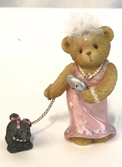 Cherished Teddies ‘Julia Bearon’ Porcelain Figural: Julia Bearon as 1920s suffragette Gloria Growlette , walking her dog. In original Box. # 685747C. Intricate detail. Carved porcelain. 3. In Ht, 3.5 in. W incl. dog, 1 1/4 in. D. Cherished Teddies, Jul