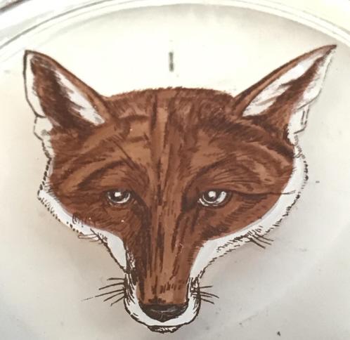 Lot 2 Fox Paperweight/Coaster, Swiss Ebauche Clock: Round glass paperweight or glass coaster. Painted on underside, face of red fox . App 3. In diameter, 3/4 in. ht. Swiss Ebauche Movements Quartz Desktop Analog Clock. battery operated (E377A). Heavy p