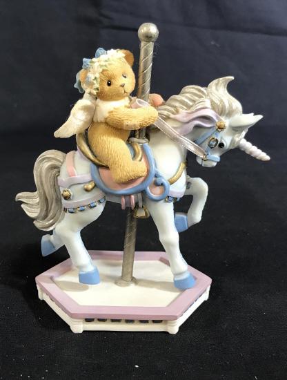 CHERISHED TEDDIES Crystal Carousel Ceramic Figure: The label reads: Cherished Teddies, Crystal. A registration number on the bottom reads 9H7/824. The number on the box and figure reads 589942. The piece has been crafted from ceramic. The piece measur