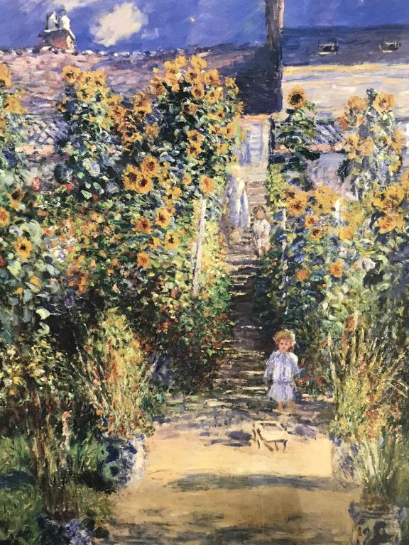 Vintage Monet Exhibition Poster, Framed: Vintage framed exhibition poster for Claude Monet at the National Gallery Of Art. Poster is set behind acrylic in gold tone metal frame. Measures approximately 36.5 inches in height by 24.5 inches in