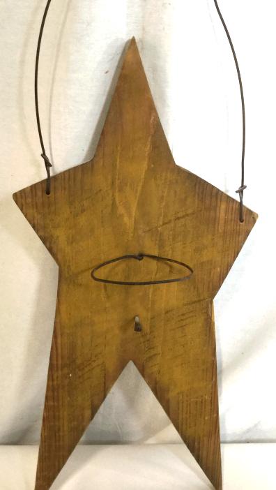 Vintage Arts & Crafts Wood Wall Decor: Hand formed Star with metal handle, back bracket for wall hanging. 21 in. Long, just Star. With handle 26 in. 11 in. wide. Early 1990s Barn nail Hammered in and is under a fixed metal circle. Possibly