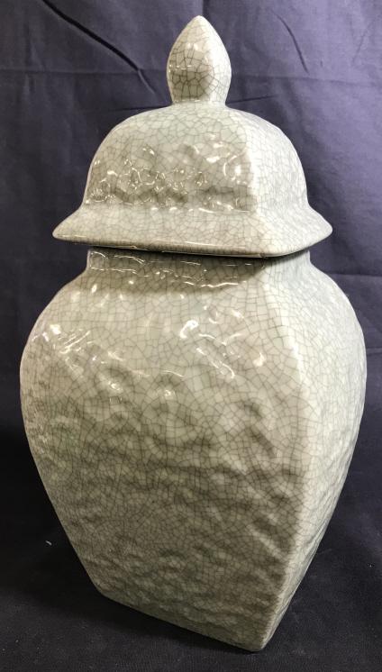 Decorative Glazed Celadon Green Ceramic Ginger Jar: This is a jade toned/celadon green, possibly vintage, glazed ceramic ginger jar. the surface is also dimpled. The piece measures approx 15.5 inches H, and 6.6 inches W. Minor wear is present on the pi