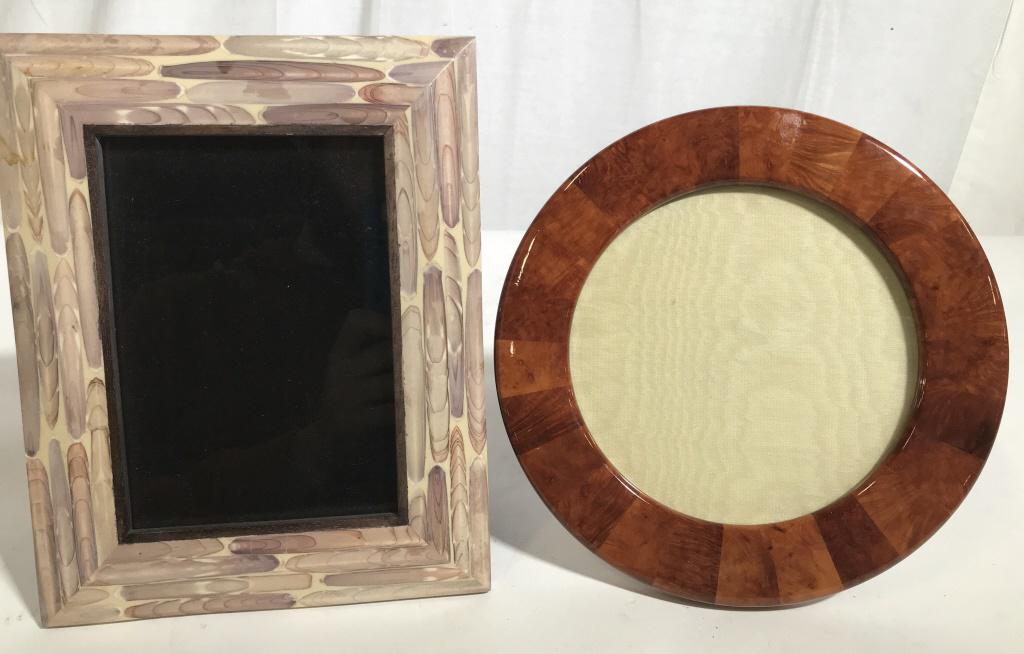 Lot 2 Wooden Picture Frames: This is a lot of two picture frames, one of the frames is from R&Y AUGOUSTI, LONDON composite material, wood style. Round burled wood style frame. The largest frame measures approx 9.4 inches H, and 7