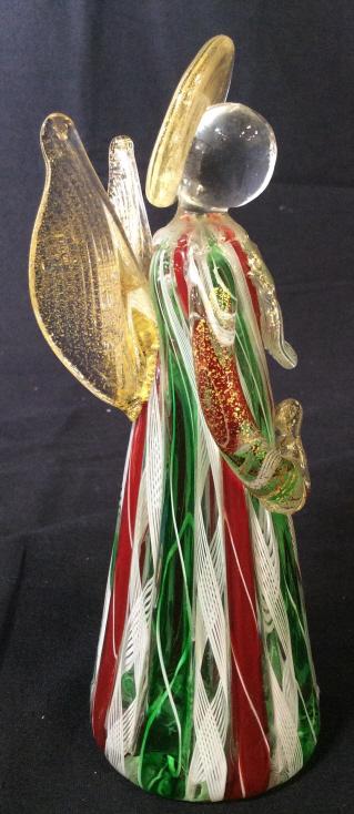 Venetian Art Glass MURANO Style Angel Sculpture: This is an Art Glass Angelic Figure Sculpture . The piece is Handblown, and colored in emerald, and crimson tones, threads of white enamel run throughout the piece. Flecks Of Gold leaf are suspended t