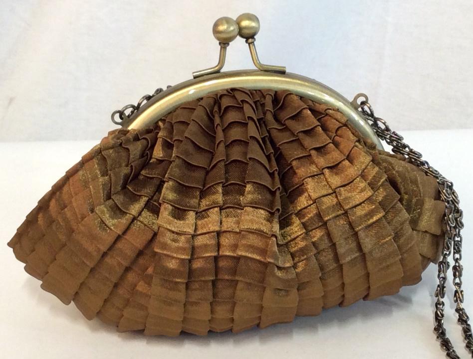 Jessica McCLINTOCK Chain Purse Clutch: Women’s Clutch Purse with chain that tucks into bag. Clam shape, double ball kiss lock. Chain hangs app 10.5 in. Bag measures 5.5in. L by 4.5 in. W by 4.5 in. D. Satin type fabric in bronze ext & in