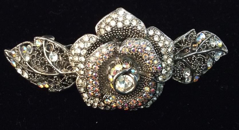 Diamanté Rose Nouveau Barrette: Marcasite & Rhinestone Hair barrette with Center rose decorated with center 8 mm bezel Set rhinestone reticulated dot metalwork, layers of rose petals with clear and iredescet rhinestones. Intricate p