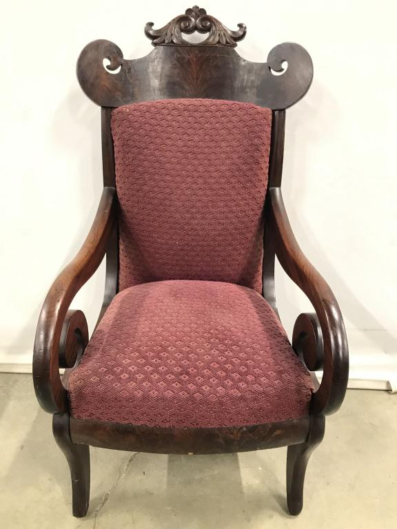 Carved Wooden Victorian Style Childrens Chair: Chair has carved wooden backrest and armrests. Chair contains maroon toned upholstery. Chair is vintage possibly antique. Vintage chair, wooden chair, carved chair, carved wooden chair, Victorian Styl