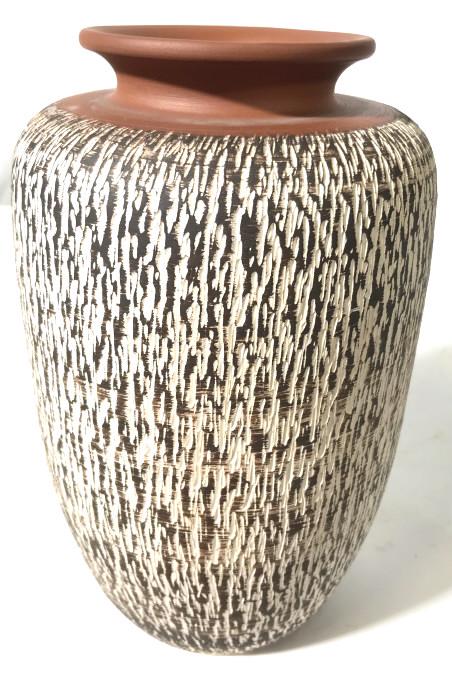 Vintage Earthenware Vase, Germany: This is a vintage earthenware vase, the piece originates in German. The underside reads Western Germany, as both a stamp and etched into the vase itself. The surface of the vase is decorated with a se