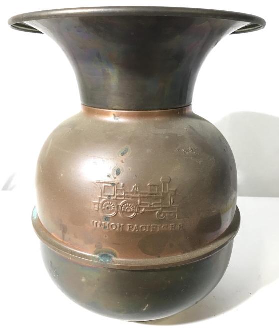 Vintage UNION PACIFIC RAILROAD Copper Spittoon: This piece is a vintage spittoon, the piece is made from copper. The UNION PACIFIC RAILROAD logo and locomotive icon can be found on opposing sides of the piece, in relief. The piece measures approx 1