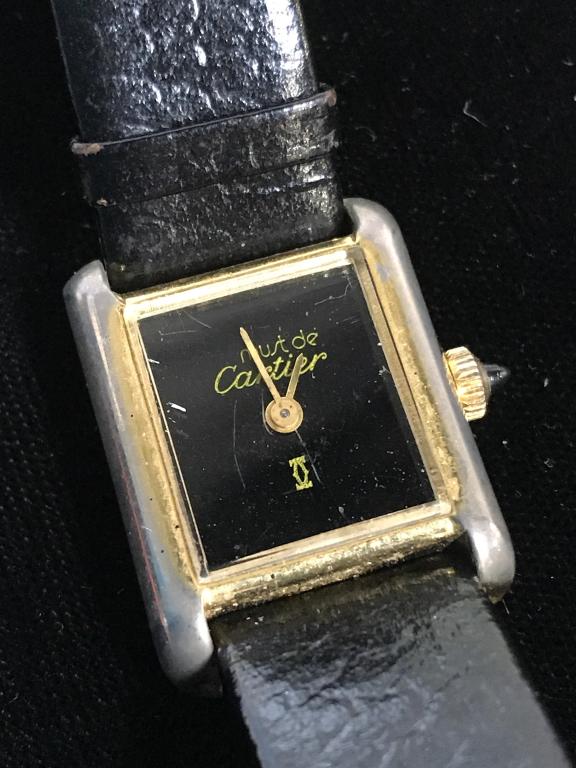 Vintage Must de CARTIER Tank Wristwatch: Swiss Made Vintage Tank 18 K Vermeil Analog Ladies Wristwatch. Possibly from late 1970s. A ‘Must de Cartier’ with Cartier logo on watch face. Mechanical hand wind movement. Hours & minutes hand. B