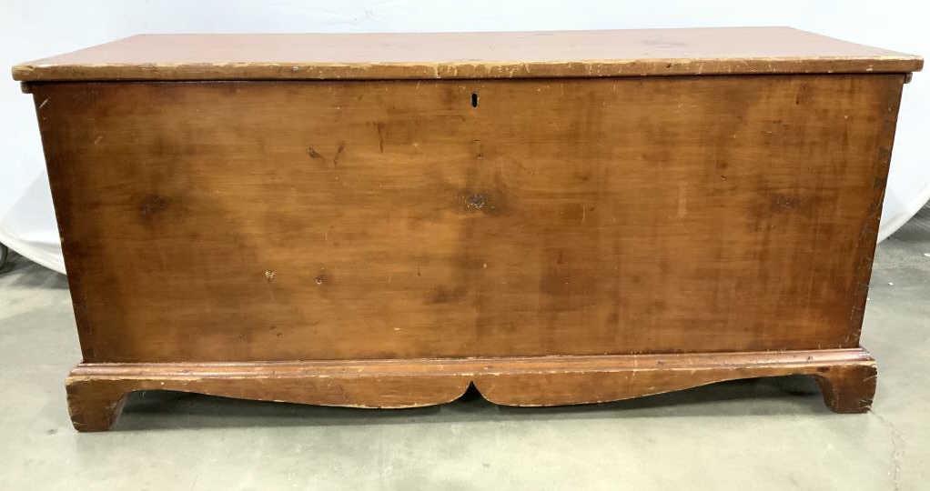 Vintage Antique Wooden Lidded Chest: Chest is wooden. Piece is lidded. Piece has keyhole near top. Base has carved wooden detail. Piece measures approx 48 inches long 18 inch inches deep 22 inches tall. Piece has evident scratches and we