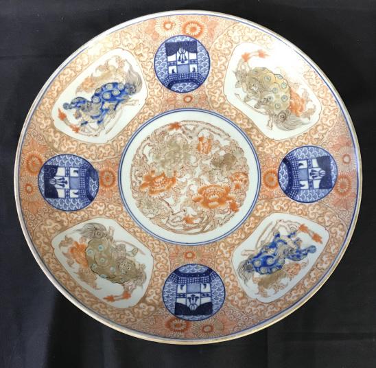 SIGNED Chinese Cizhou Dragon + Fu Centerpiece: Decorative centerpiece plate, Hand Painted, 15 3/4 in. Depicts 2 dragons, 2 Foo Dogs, blue medallions of people on a bridge & center floral medallion. Orange, Blue & mocha colors, painted under and ov