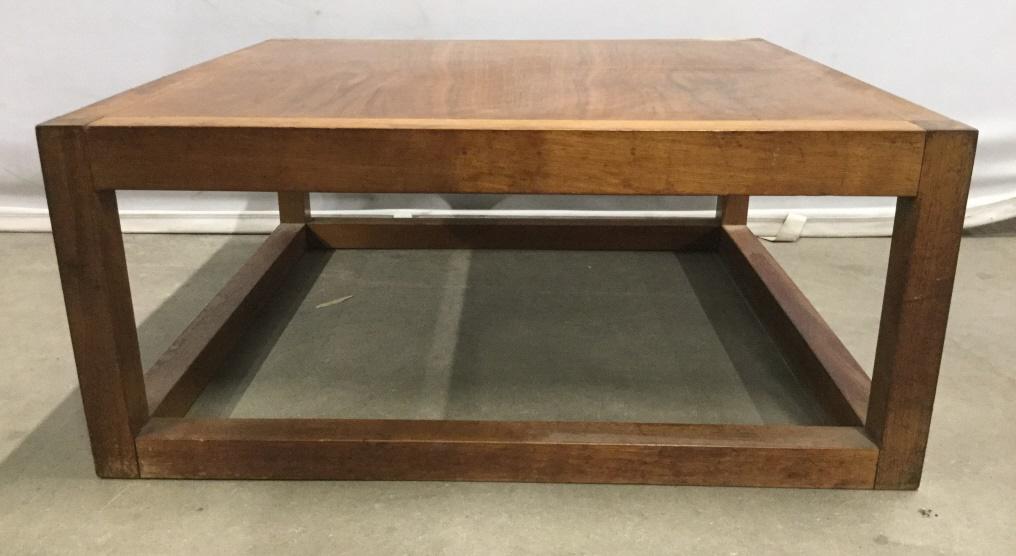 Pair Low Wooden Tables: Lot includes 2 wooden tables. Each table has beige wooden tone. Side tables, end tables, coffee tables, low tables, bedside tables. home furnishings and accessories Each measures approx 24 inches squa