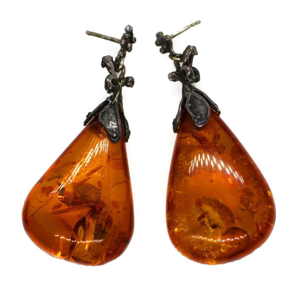 Art Nouveau Amber Drop Pendant Earrings: 3 pcs, 1 pair with extra earring. teardrop shape amber pendants, unique shape and variations on interior striations due to natural material. Dark silver toned metal, floral art nouveau inspired design