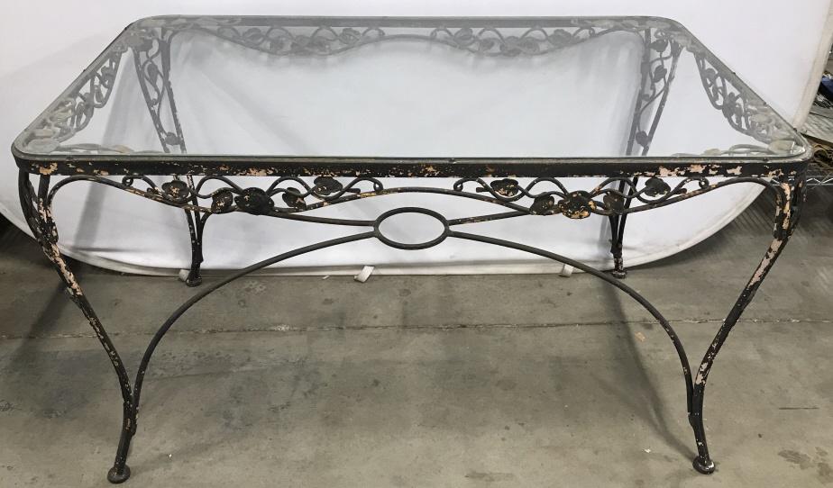 Vintage Salterini Style Iron And Glass Table: Vintage wrought iron patio and garden table made in the manner and style of John Salterini. Features a rectangular top with rounded edges that holds a pane of glass supported by graceful curved legs.