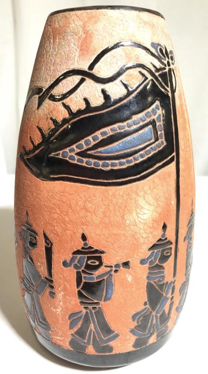 Vintage Earthenware Decorative Vase, Vietnam: This piece is a Vietnamese earthenware vase, the piece is vintage. The vase is colored in terra-cotta, Adobe, and Carolina blue tones. The piece depicts several soldiers marching, with their leader on