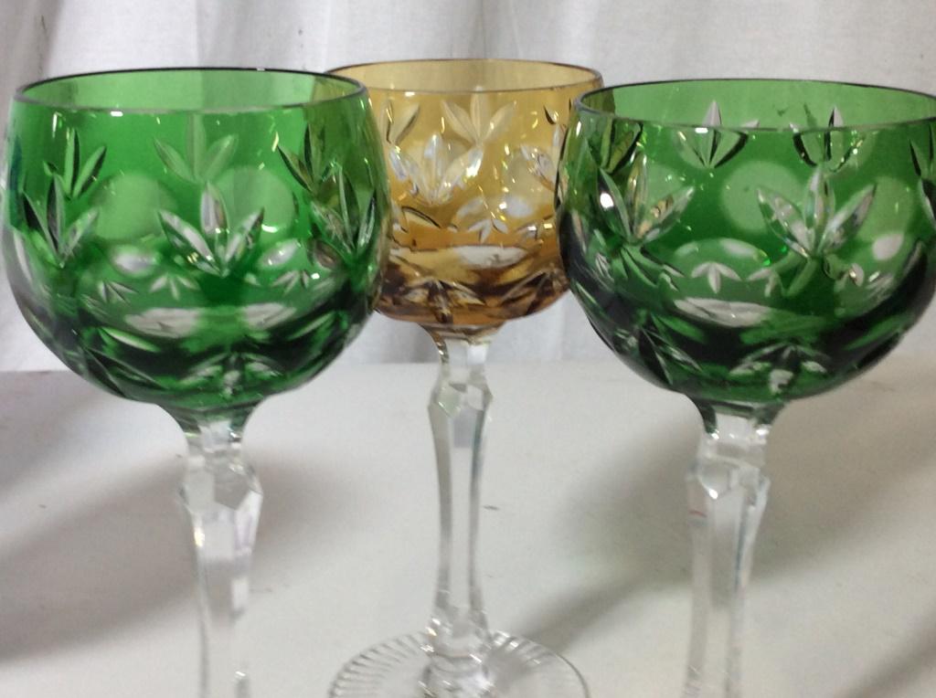 Vintage Set 10 Bohemian Crystal Goblets: Colorful set of pink, amethyst, emerald green, cobalt blue, dark aqua, Amber. Reticulated embossed line design on base, cut lotus flower design and alternating sphere pattern on goblet. 7 3/4 in ht, 1